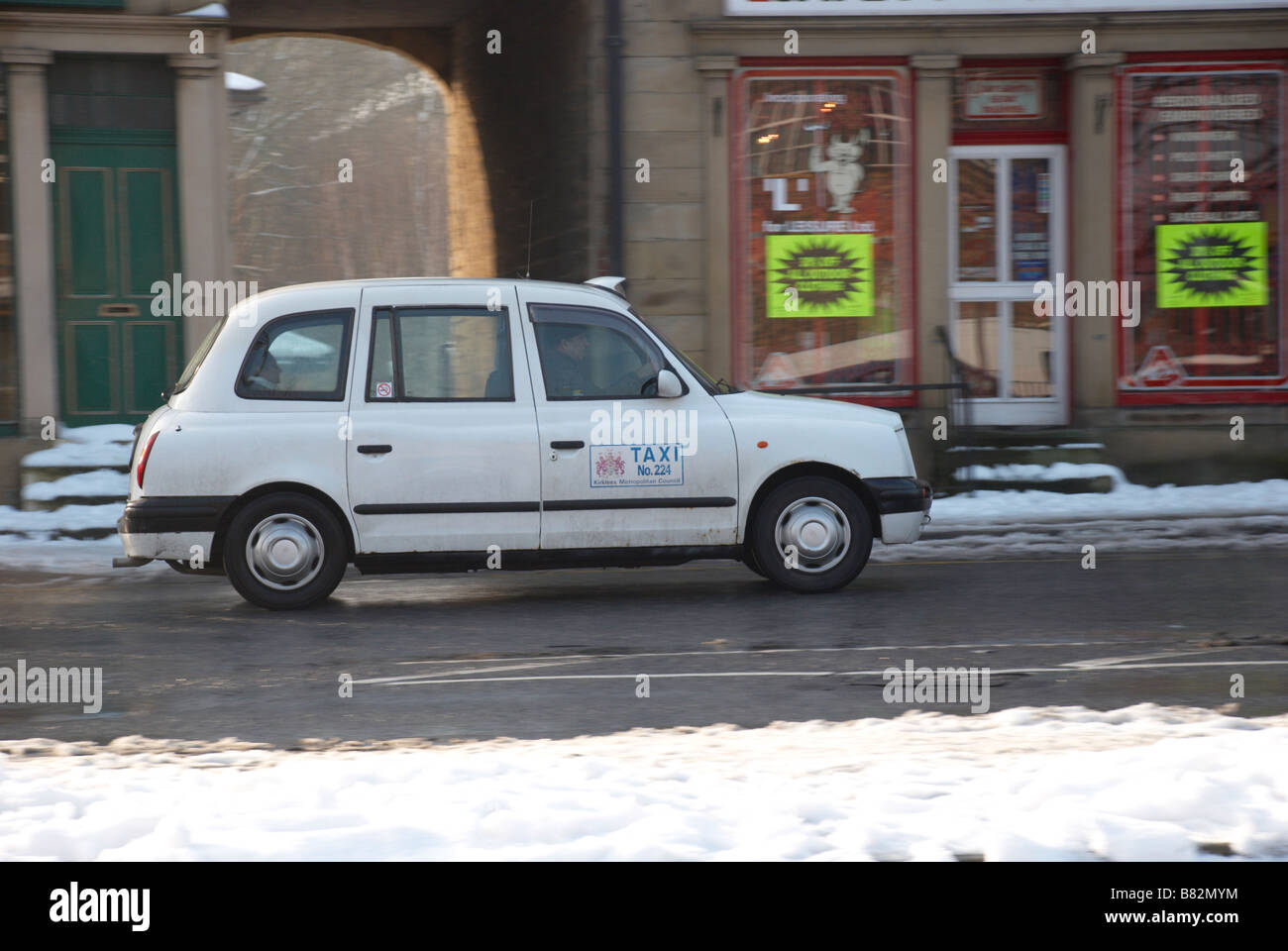 white taxi in the snow Stock Photo