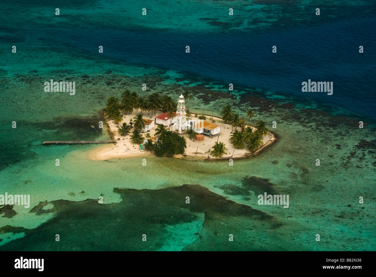 Aerial view Belize coral reefs and island, paradise, tropical island, atoll, white sand, palm trees, relax, vacation Stock Photo