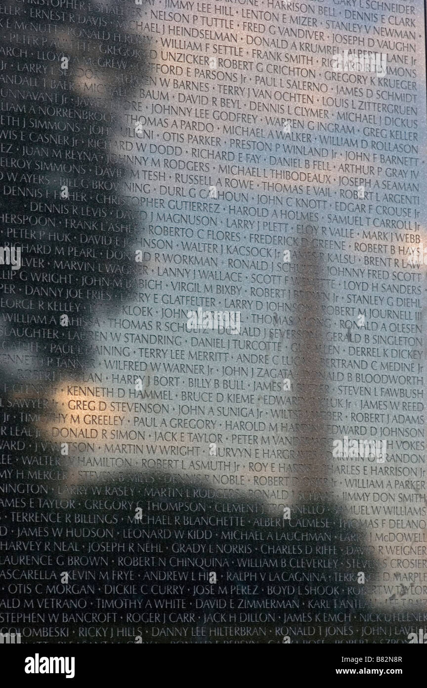 Vietnam War Memorial, Washington D.C. Washington Monument reflected on black granite, soldier names reflect in sky, History. Stock Photo