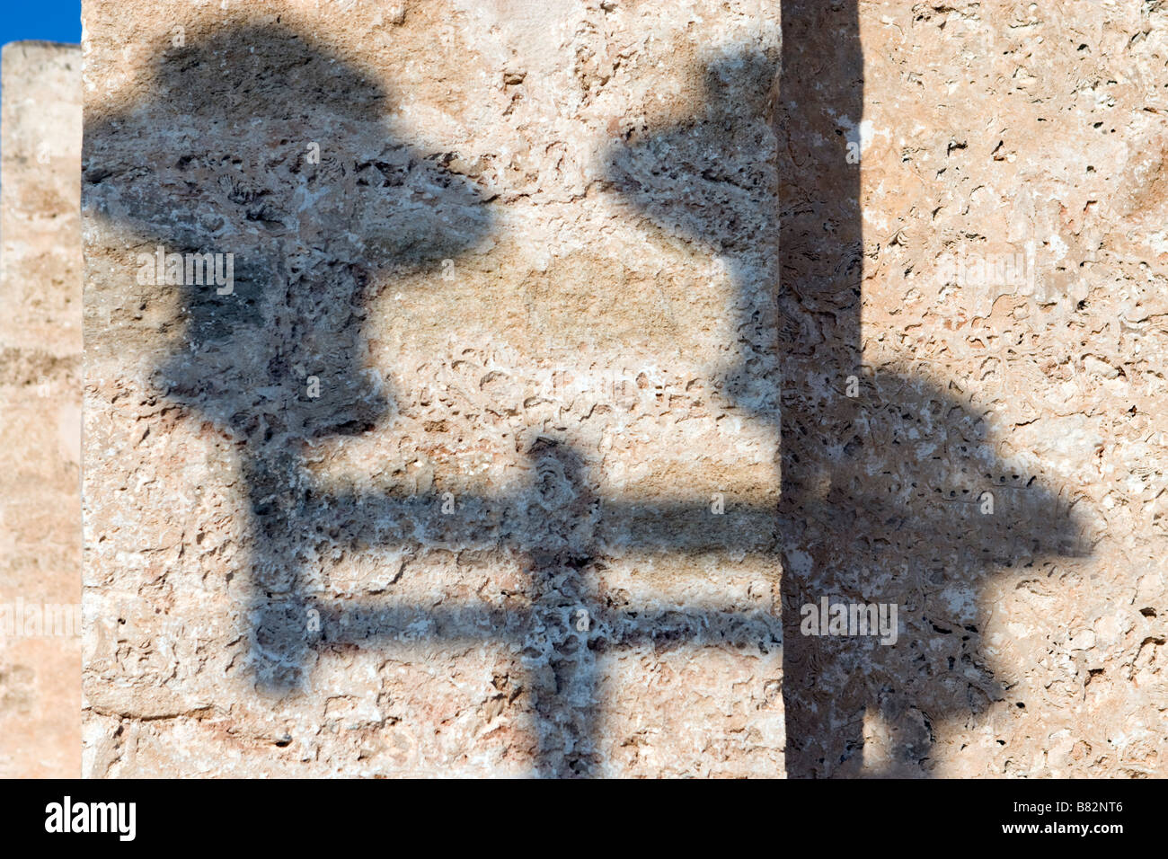 Details of yellow stone home wall with street light shadow on it ...