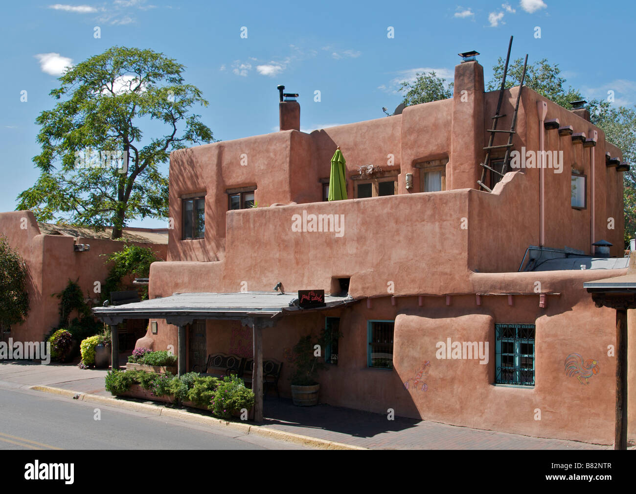 Typical adobe architecture two storied house and shop Santa Fe New Mexico USA Stock Photo