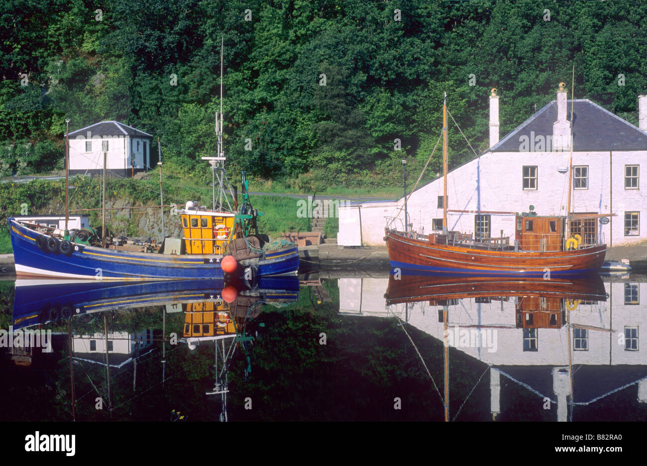 Crinan village harbour boats Scotland UK Scottish coast coastal scenery view reflection Stock Photo
