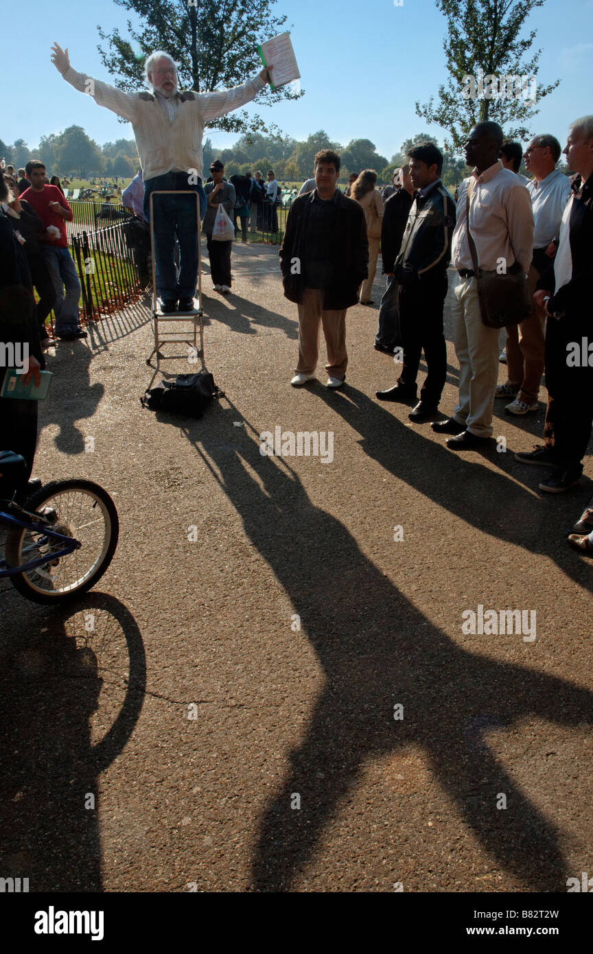 A religious speaker at Speakers Corner with arms outspread giving a