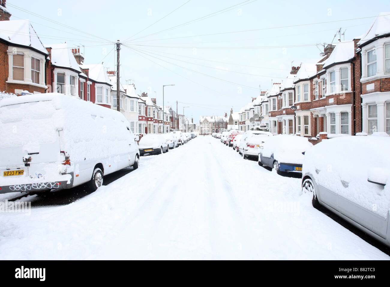 Snow covers a residential street in Willesden, North west London Stock Photo