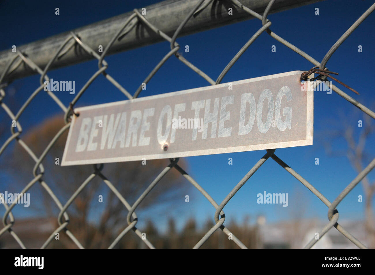 'Beware of the Dog' sign on a chain link fence. Stock Photo