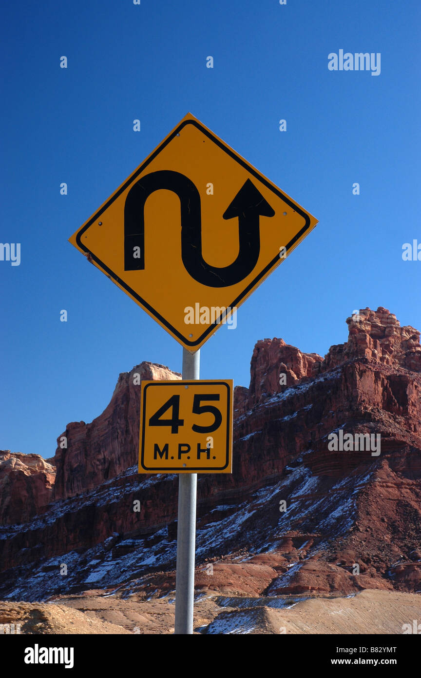 A windy road sign through the Spotted Wolf canyon in Utah, near the San Raphael Swell. Stock Photo