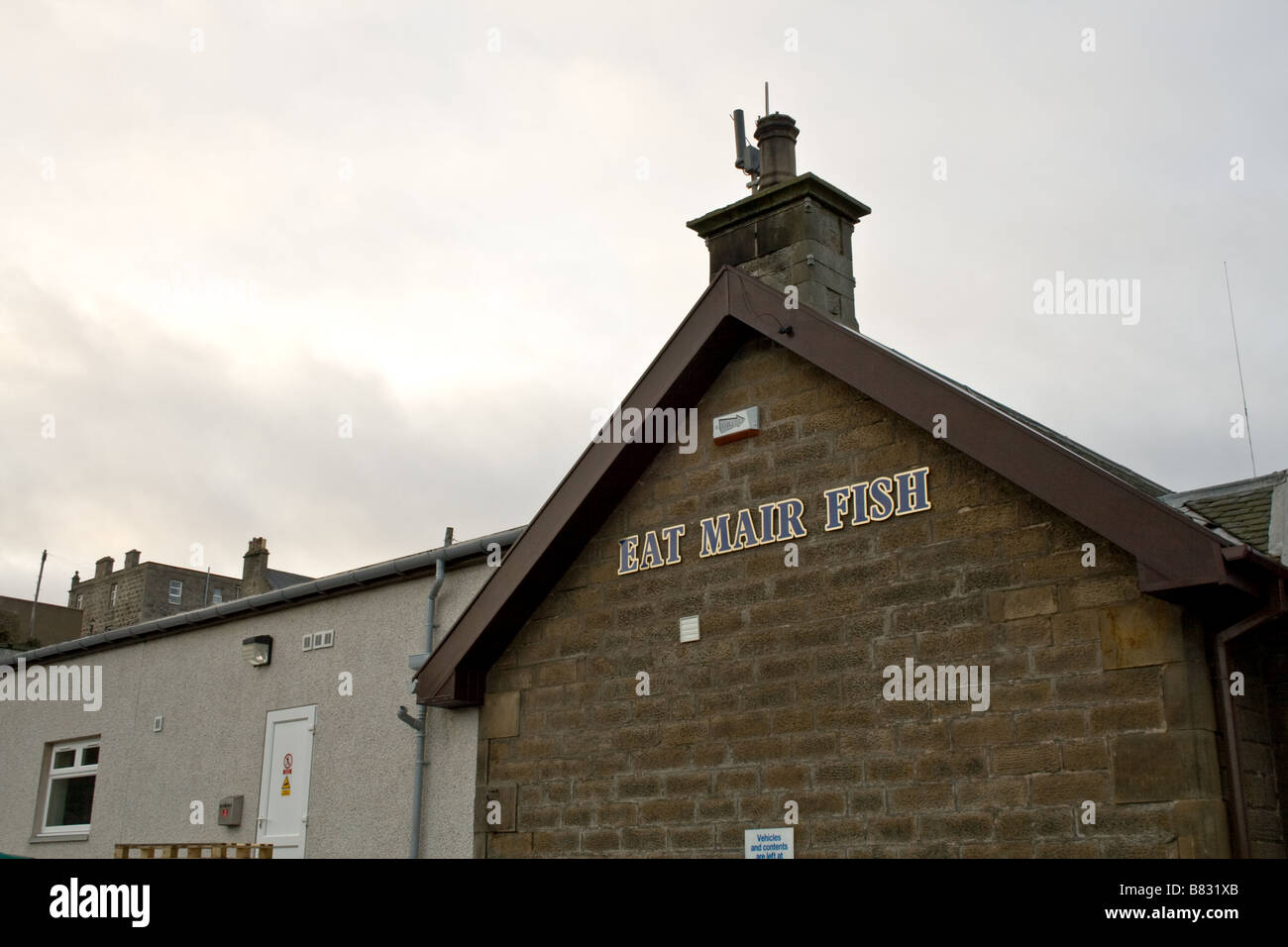 Small fish market with ethnic sign in Buckie Scotland Stock Photo