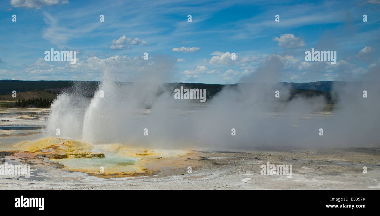Geyser erupting hot water from an underground spring in Yellowstone National Park Stock Photo