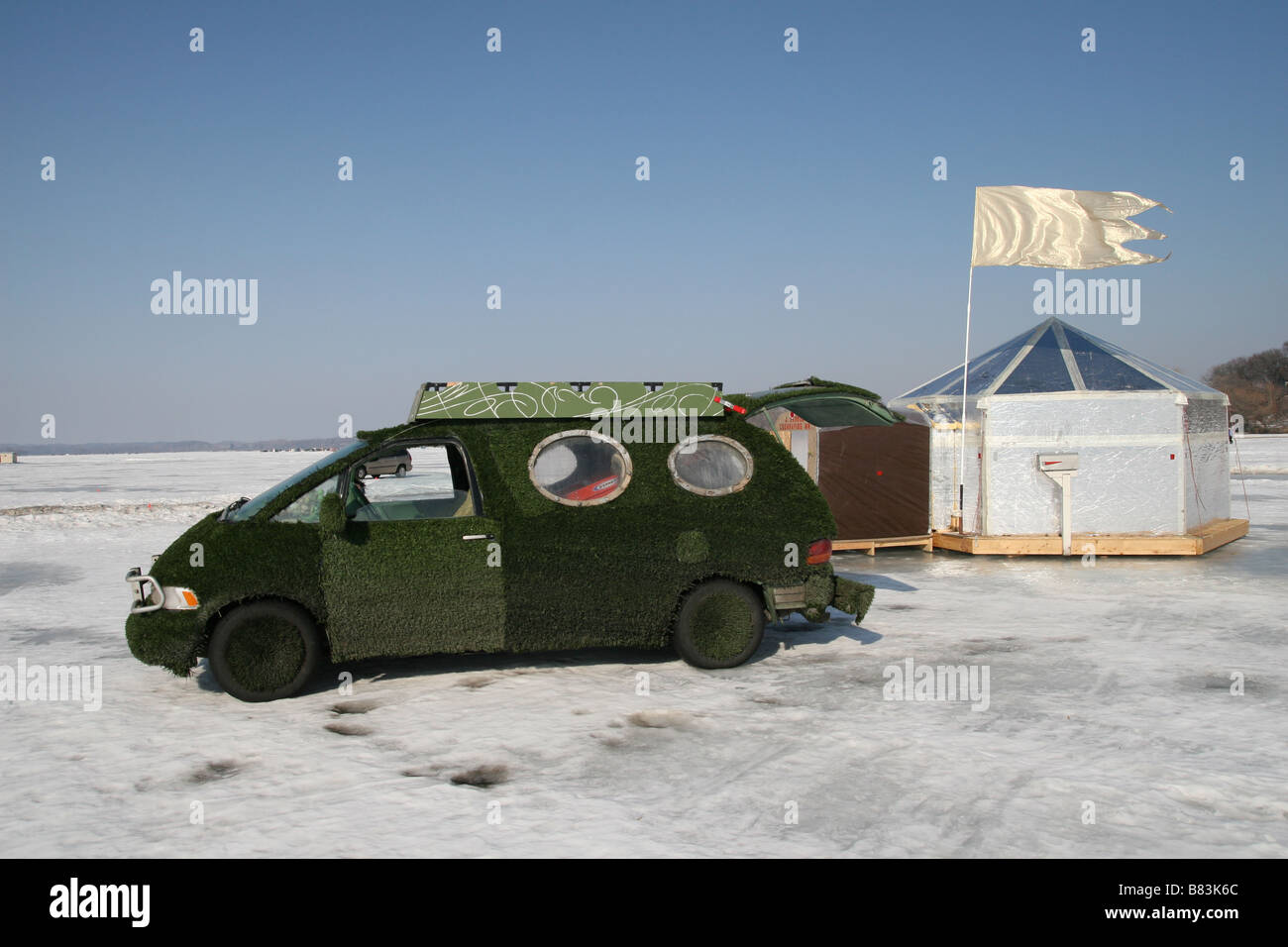 A car covered in turf at the Art Shanty Project in Minneapolis, Minnesota. Stock Photo