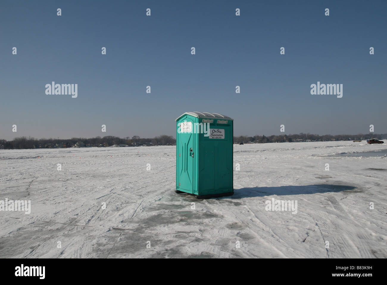 A portable toilet on frozen Medicine Lake in Minneapolis, Minnesota. Stock Photo