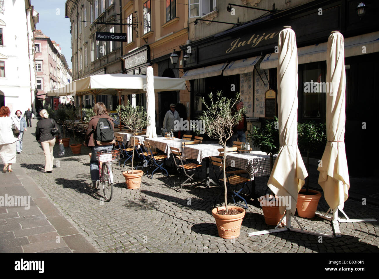 Al-fresco cafes, bars and restaurants line the narrow streets of the Old Town in Ljubljana, the capital city of Slovenia Stock Photo