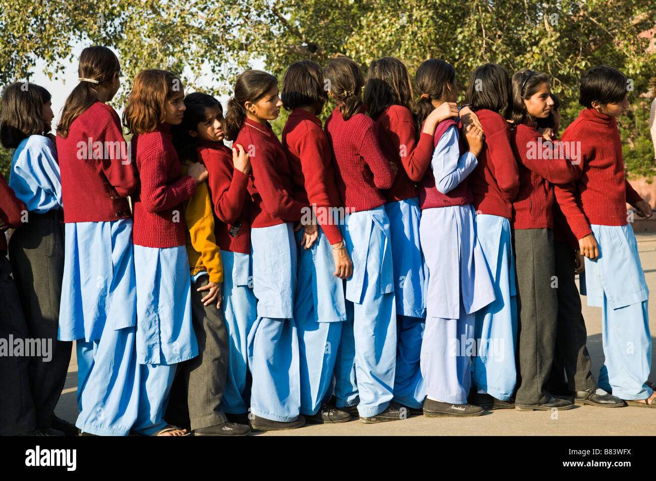 Scoolgirls standing in line to get into the Red Fort in Old Delhi India Stock Photo