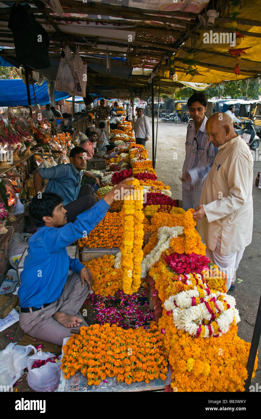 Flower sellers with marigold garlands at Choti Chaupar square in Jaipur Rajasthan India Stock Photo