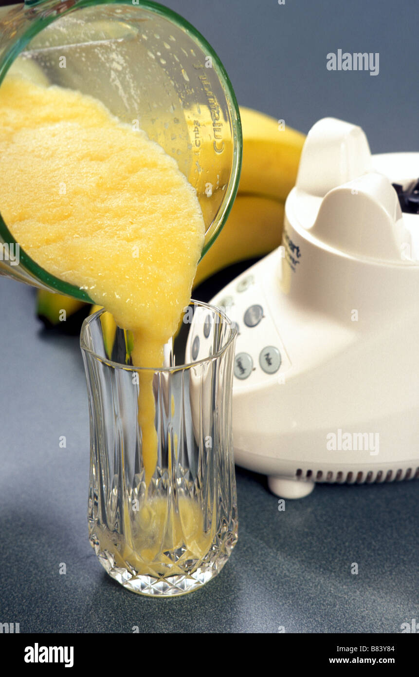 banana blended drink and blender Stock Photo Alamy