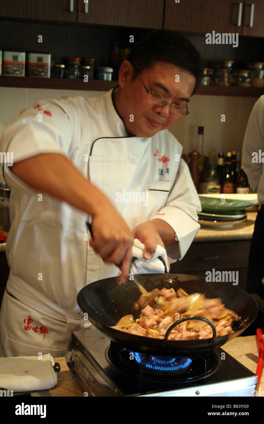 Taiwanese TV Chef Ko Juh Nein Cooking with Wok in Taipei in Taiwan Stock Photo