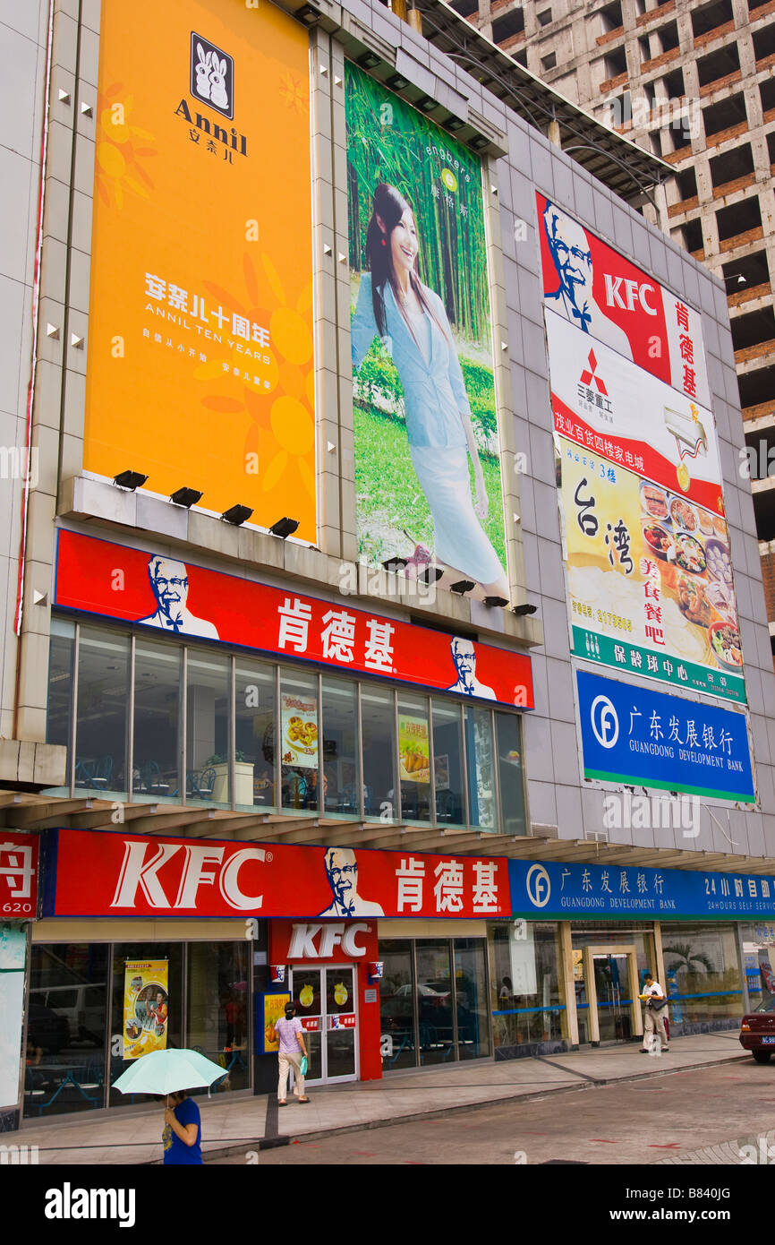 ZHUHAI, GUANGDONG PROVINCE, CHINA - Kentucky Fried Chicken fast food restaurant exterior with billboards above. Stock Photo