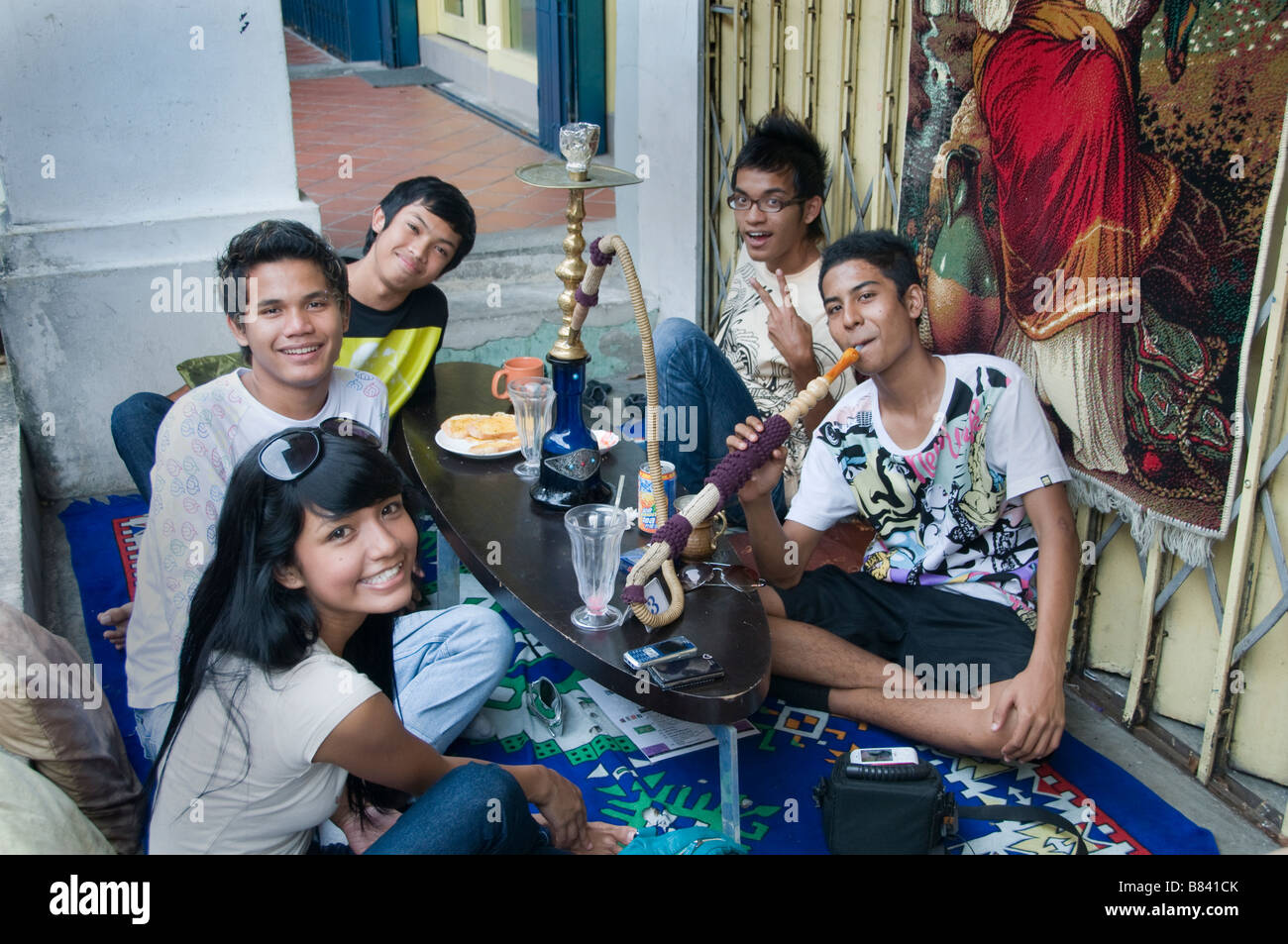 Teenager Arab Quarter Singapore Kampong Glam Smoking water pipe Stock Photo