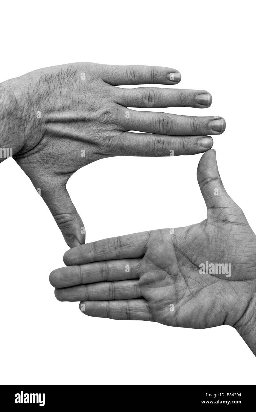 Cutout of two hands in back and white used to frame a scene / picture / photograph. Stock Photo