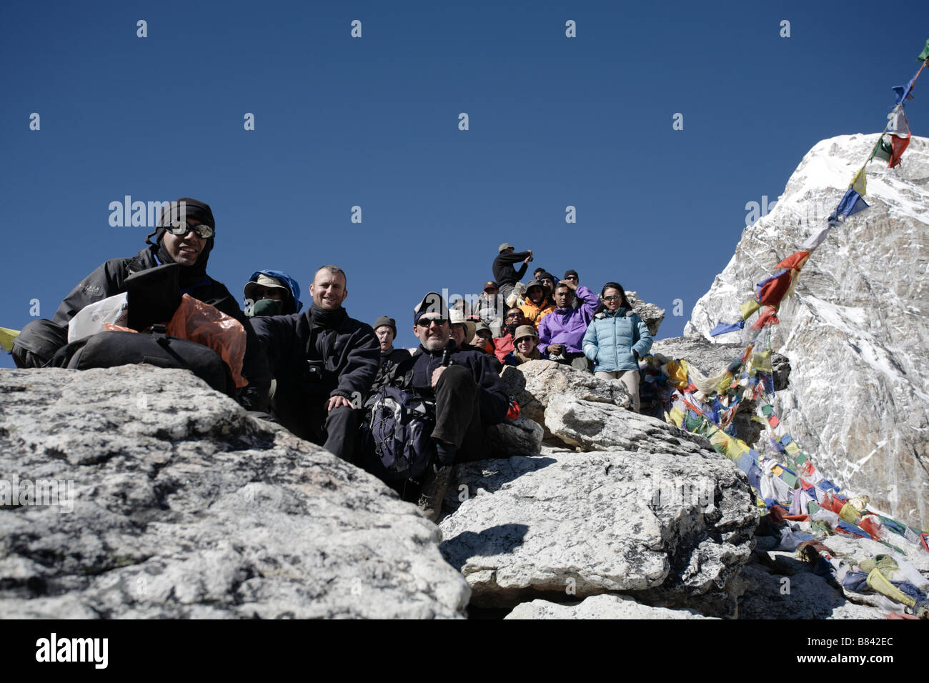 Hikers posing for a photograph having summited Kala Patthar Stock Photo