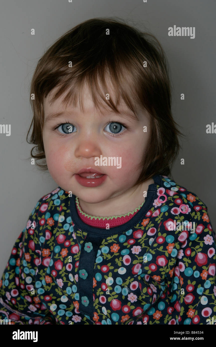 A one year old baby girl with bright blue eyes Stock Photo - Alamy