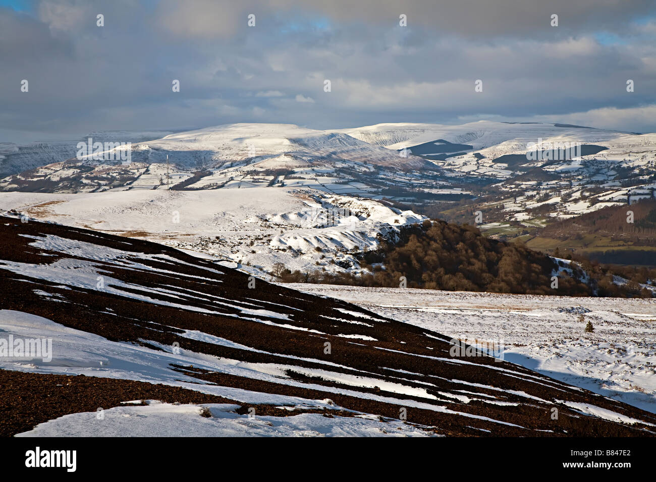 View over the Black Mountains in winter with old quarries covered in