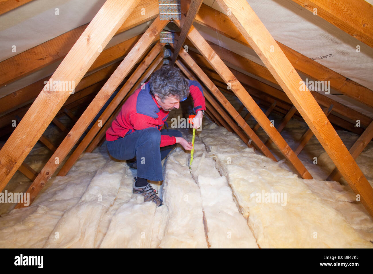 Loft Insulation To Cut Down Heat Loss In A House Loft Stock Photo