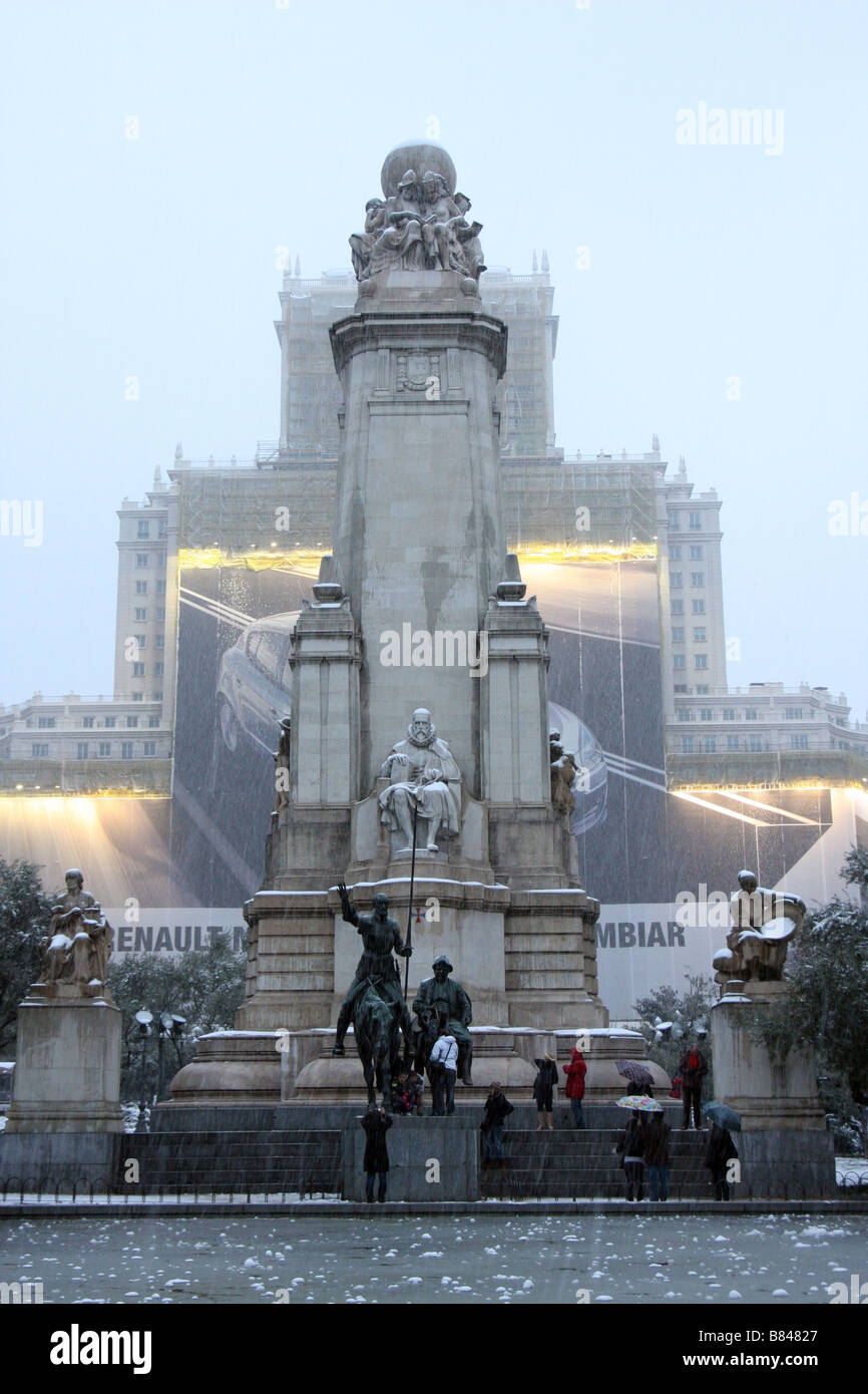 Snow covered monument to Miguel de Cervantes Saavedra, writer of Don Quixote, at the centre of the Plaza de España in Madrid Stock Photo
