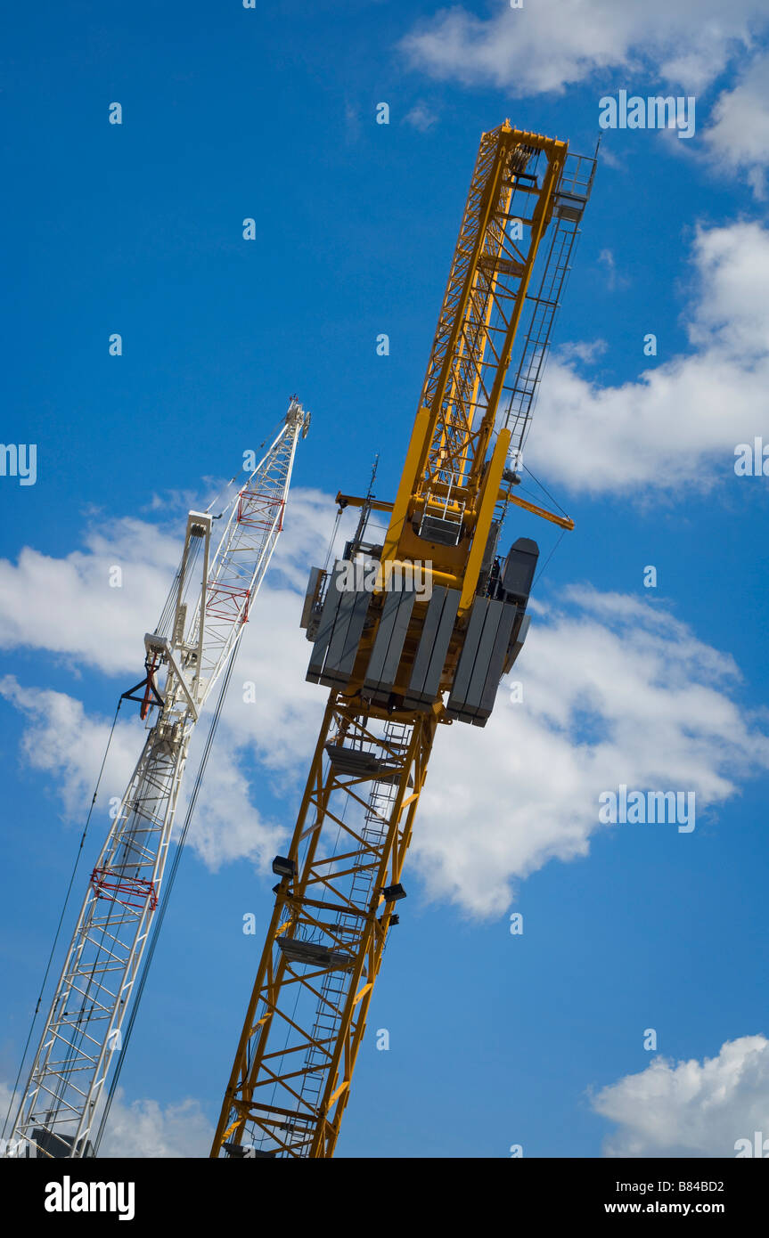 Construction cranes against the sky Stock Photo - Alamy