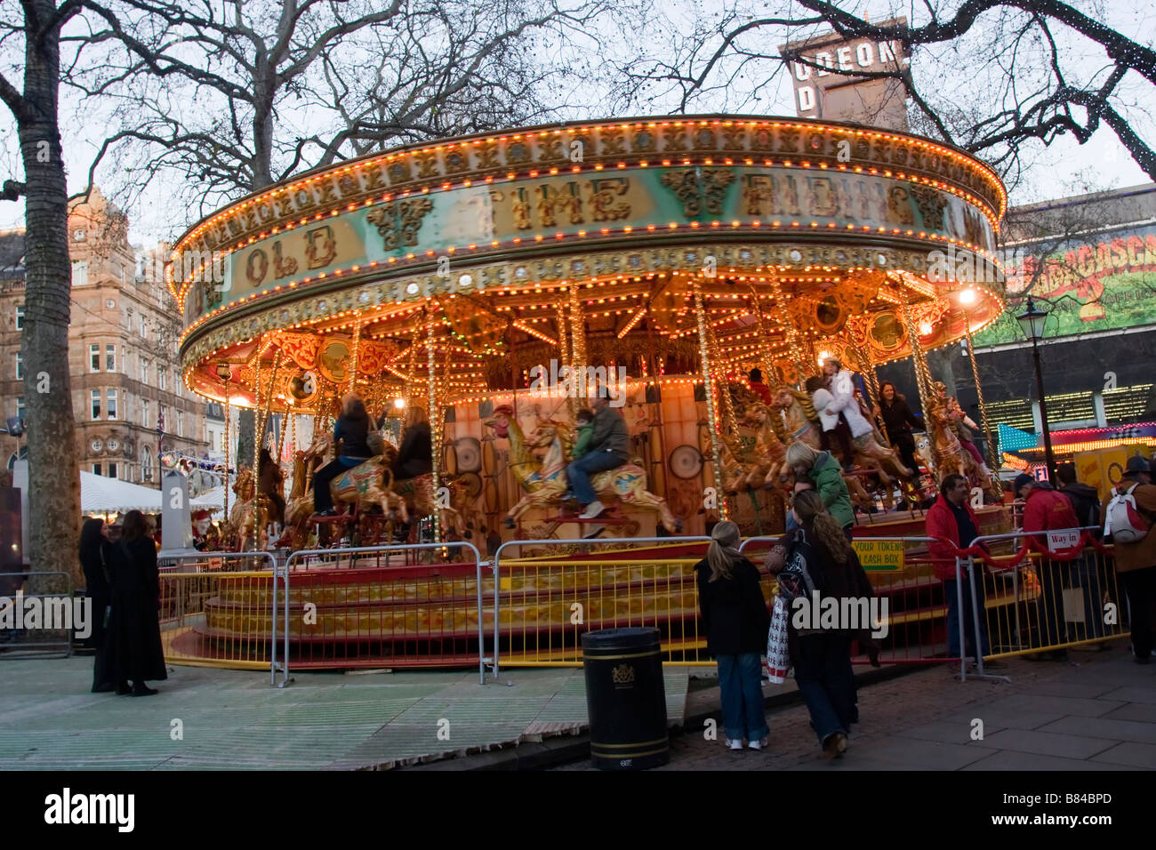 Carousel at Christmas Fair in Leicester Square, London England Great Britain GB UK Stock Photo
