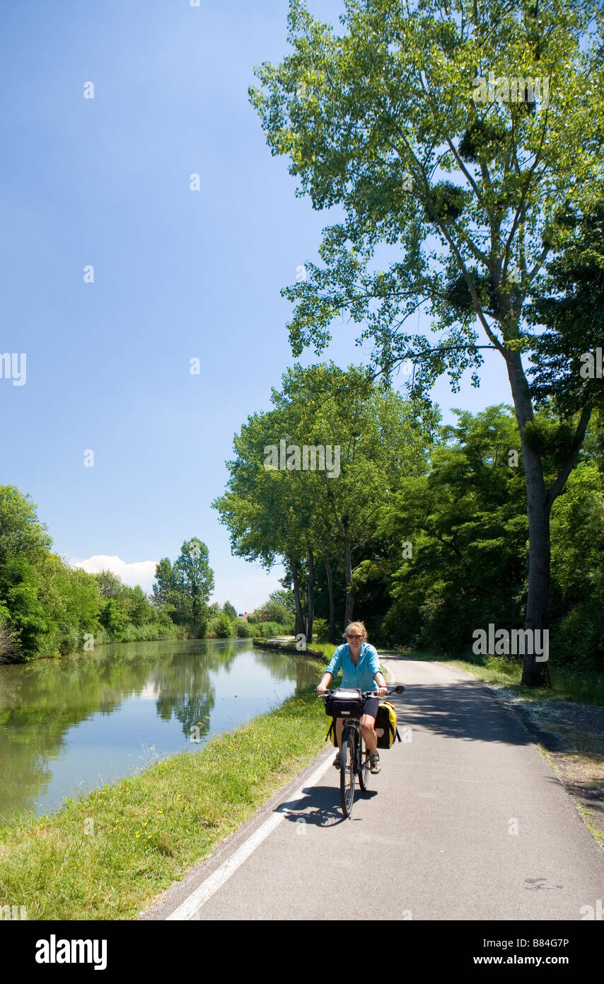 Cycling by the Canal du Centre Stock Photo