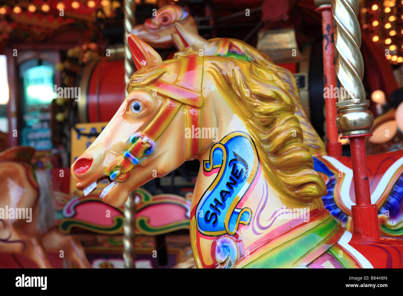 'Merigoround' horses head, painted, colourful at a fairground. Stock Photo