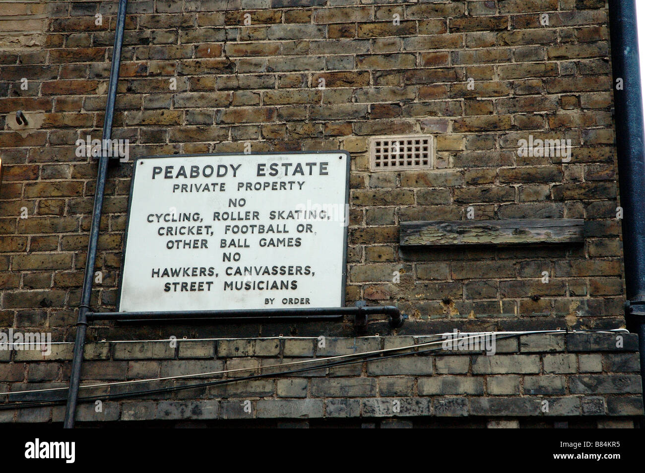 Old Peabody estate warning sign in London housing estate, pimlico Stock