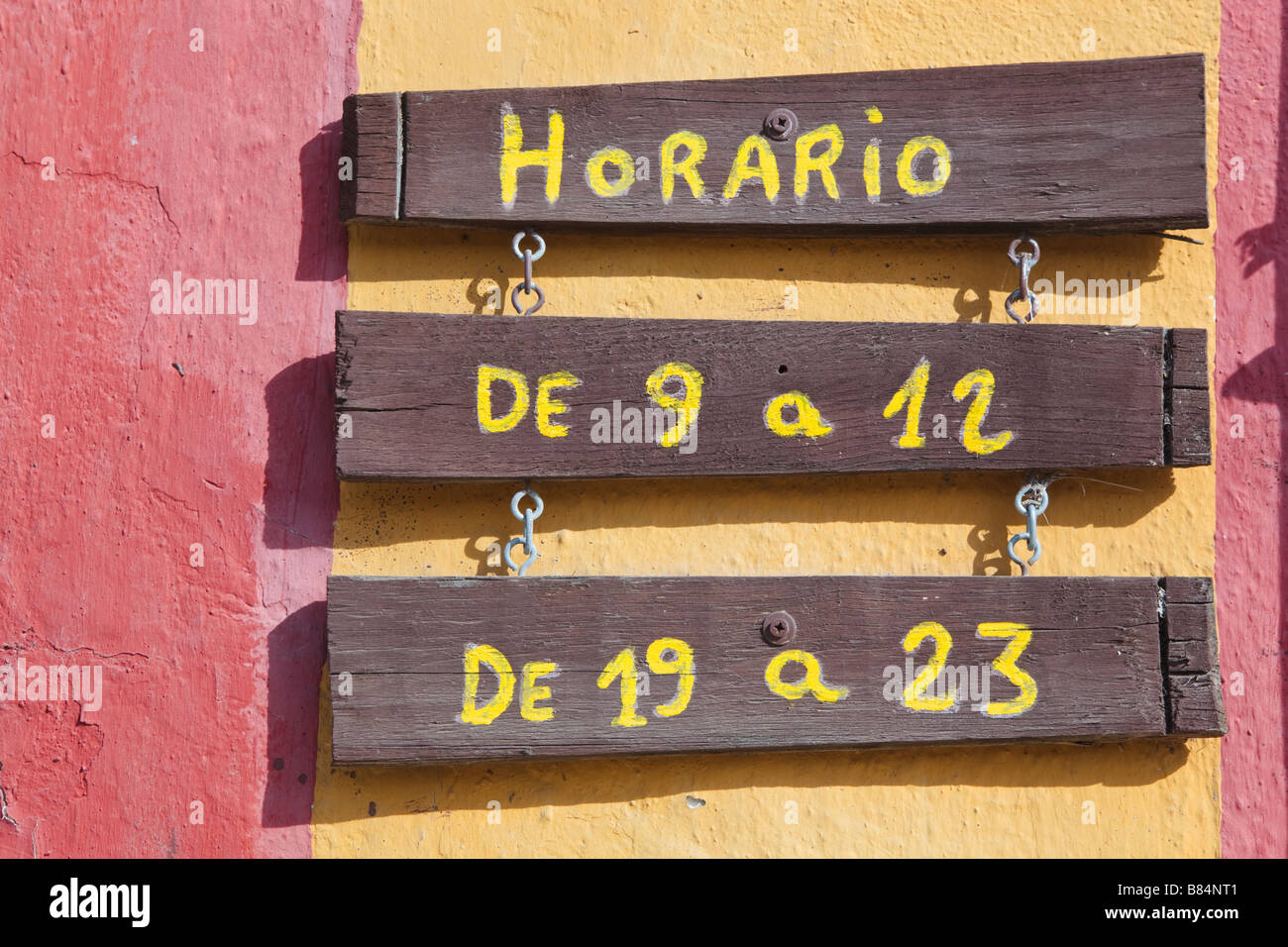 Horario or Opening Hours notice in the Spanish language outside a Spanish business Stock Photo