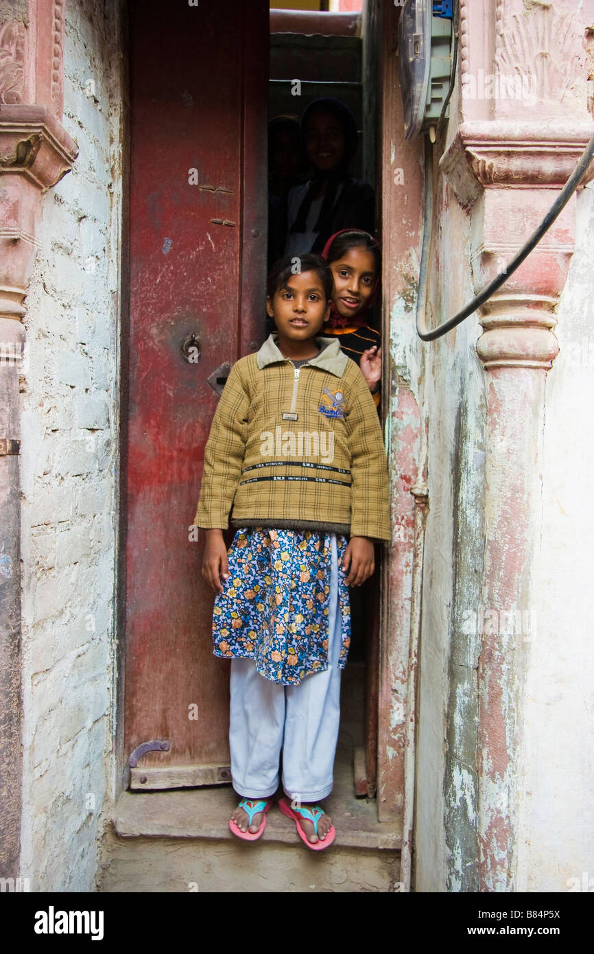 Girls standing at door entrance Bikaner Rajasthan India Stock Photo