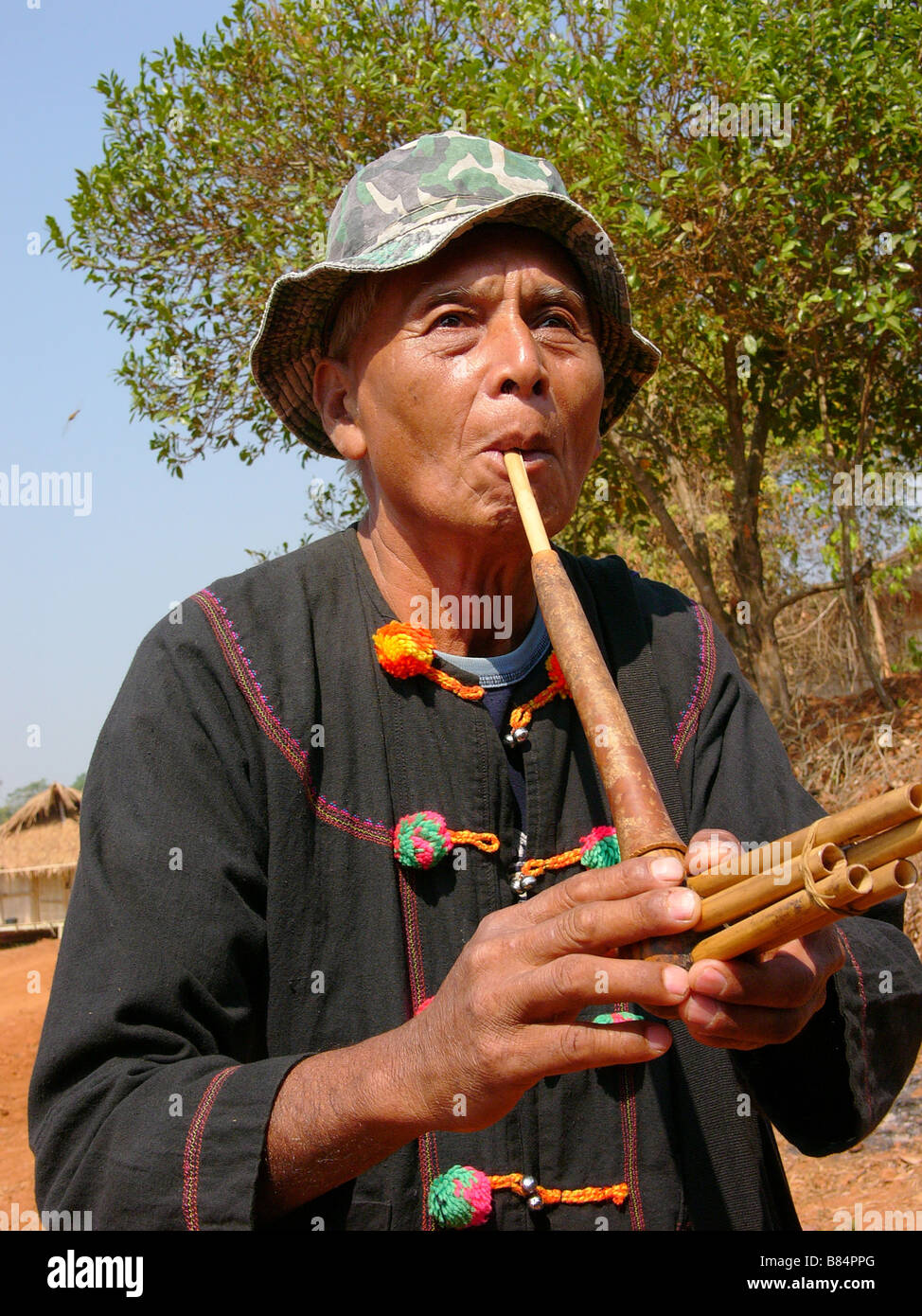 Man playing flute from the hill tribe Lahu people in Thai Thailand Laos Vietnam China and Myanmar/Burma Stock Photo