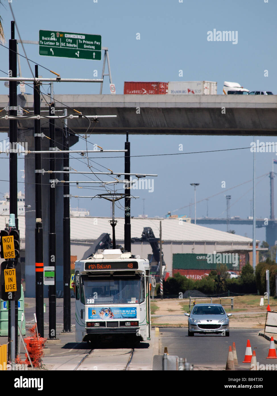 TRAM WAITING AT ROAD WORKS WITH BOLTE BRIDGE IN BACKGROUND MELBOURNE VICTORIA AUSTRALIA Stock Photo