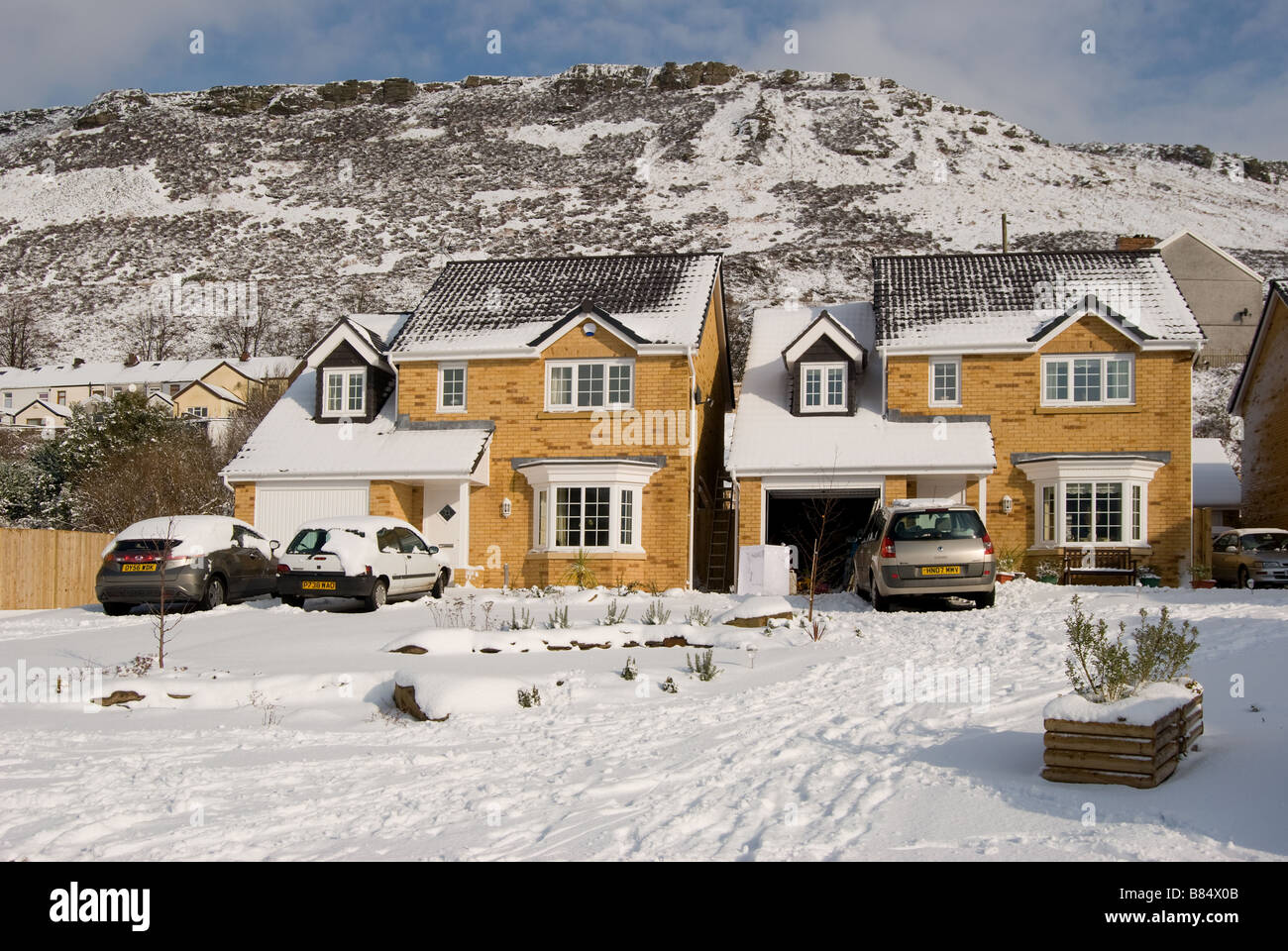 Barratt houses in Williamstown, South Wales, Great Britain, covered in snow. Stock Photo