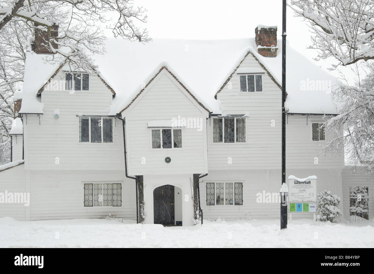 White Hall covered in snow: 16th century timber framed and weather boarded house, now a museum, Cheam, south London, England Stock Photo