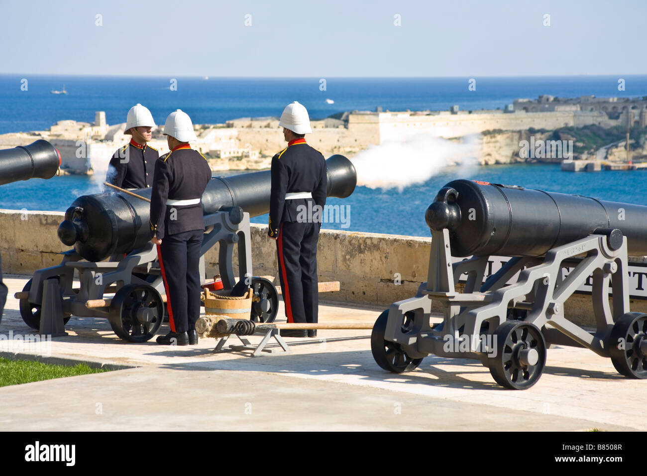 Volunteers firing of the noon day gun. . Saluting Battery, Valletta