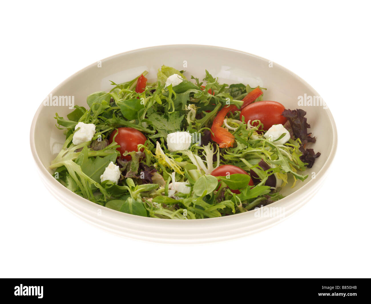 Fresh Healthy Mixed Salad With Feta Cheese Served On A Plate Isolated Against A White Background With No People And A Clipping Path Stock Photo