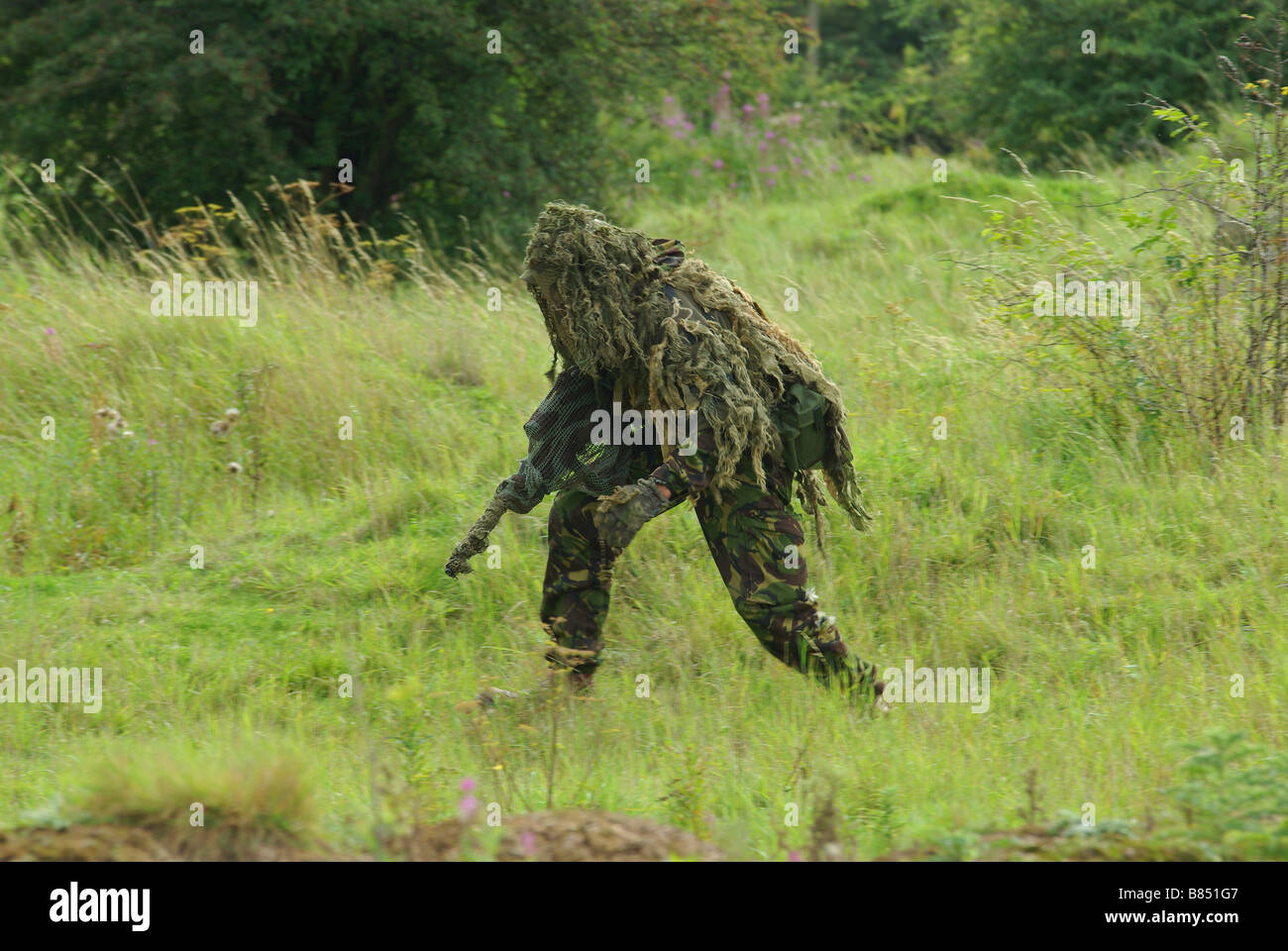 Sniper in Ghillie suit Stock Photo