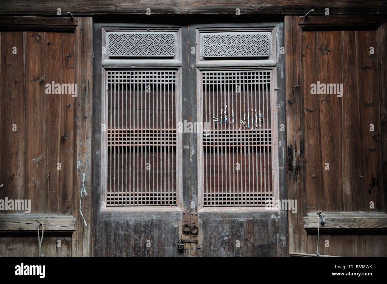 Antique Chinese carved wood windows in a Qing Dynasty building in Yifeng, Jiangxi, China. Stock Photo
