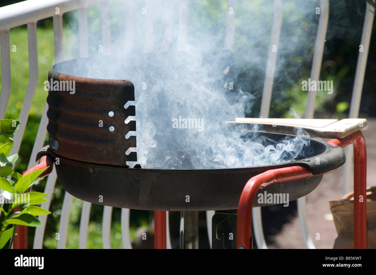 Barbecue smoking outside Stock Photo