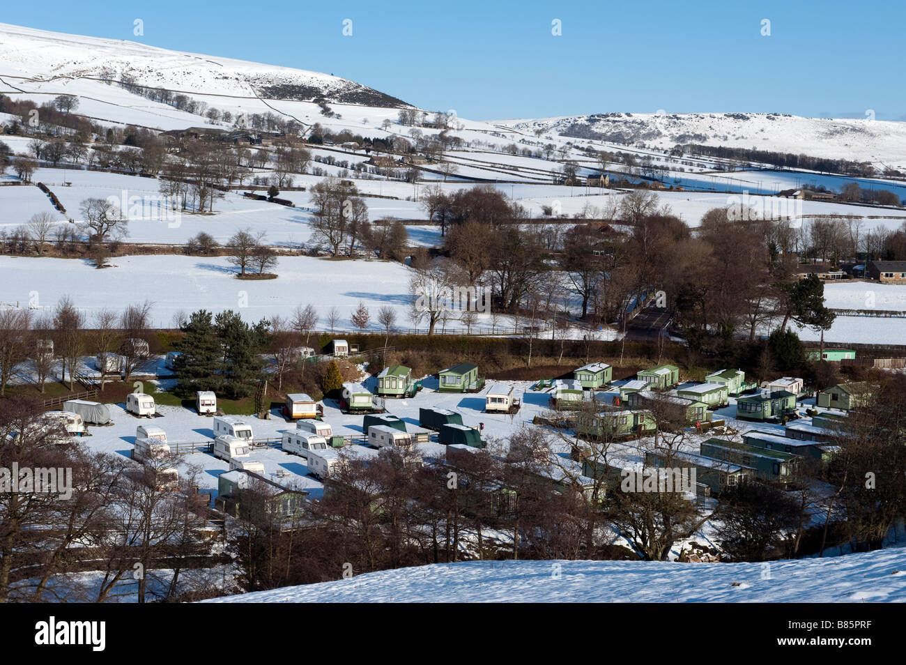 Caravans overwintering at Laneside Caravan and trailer campsite at Hope, Derbyshire, England Stock Photo