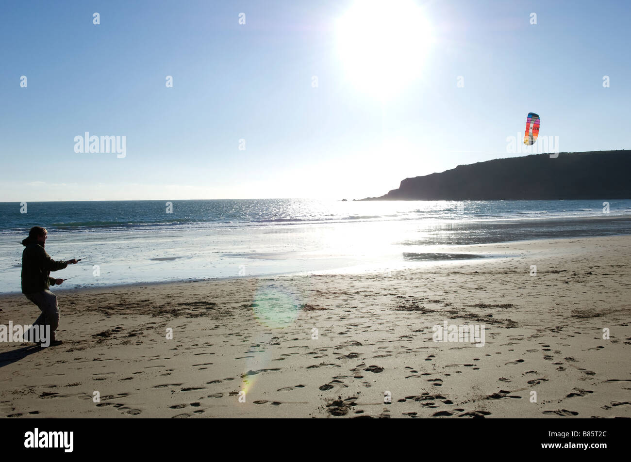 Kite flying on the beach Freshwater East Pembrokeshire West Wales UK Stock Photo