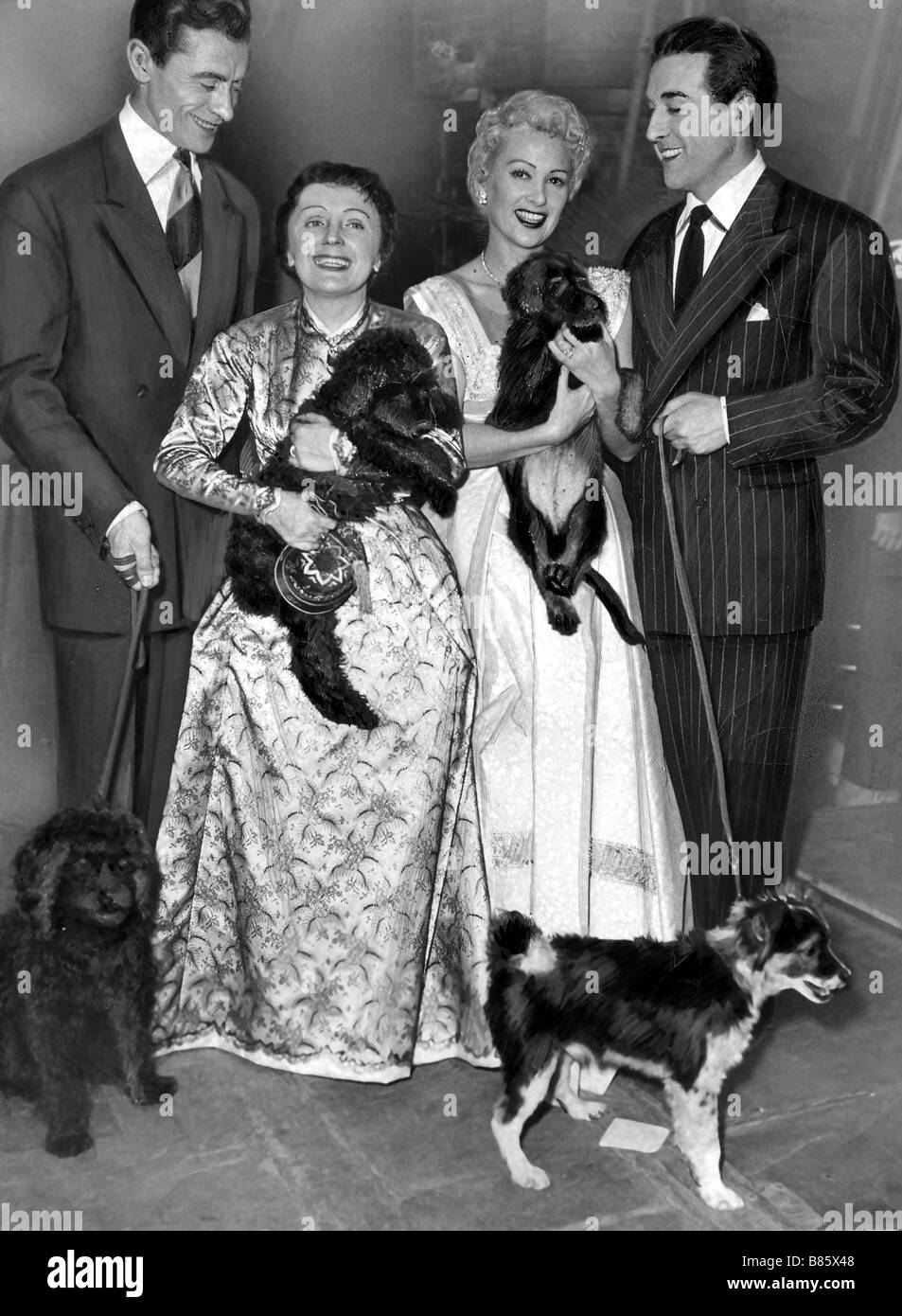 Piaf between Robert Lamoureux, Martine Carol and Luis Mariano, 1953 Stock Photo