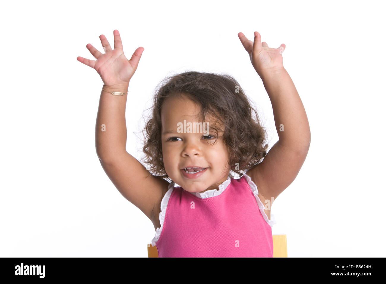 Portrait of a happy little girl with her hands up Stock Photo - Alamy