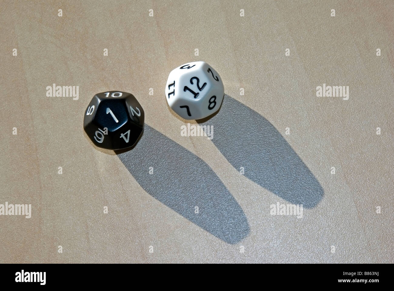 twelve sided dice black and white pair Stock Photo