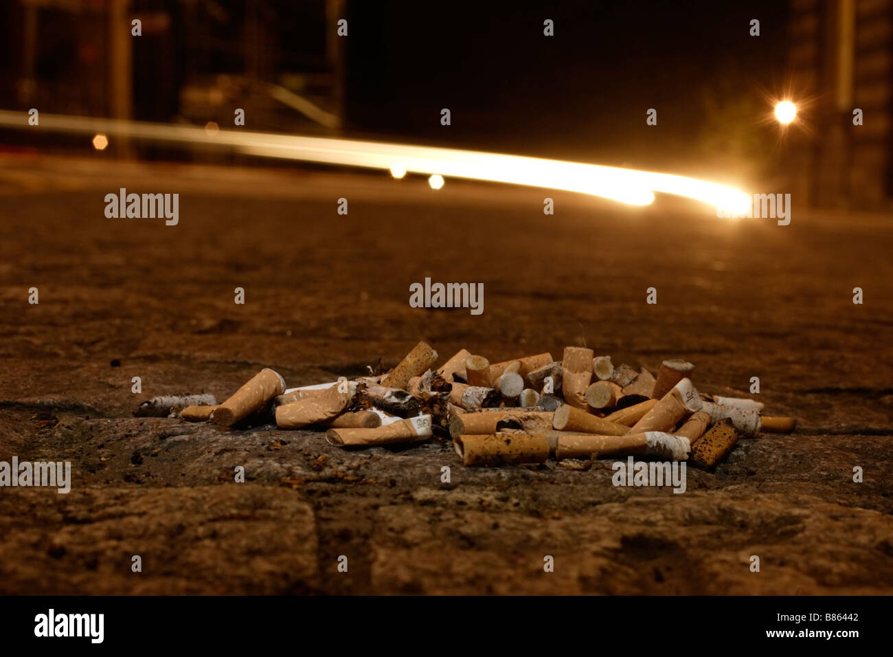 cigarette at night Cigarette litter night on streets hi-res stock photography and images