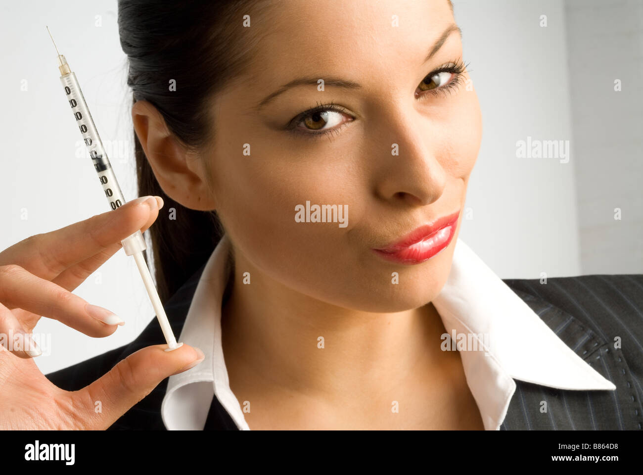 woman pouting with botox needle Stock Photo Alamy